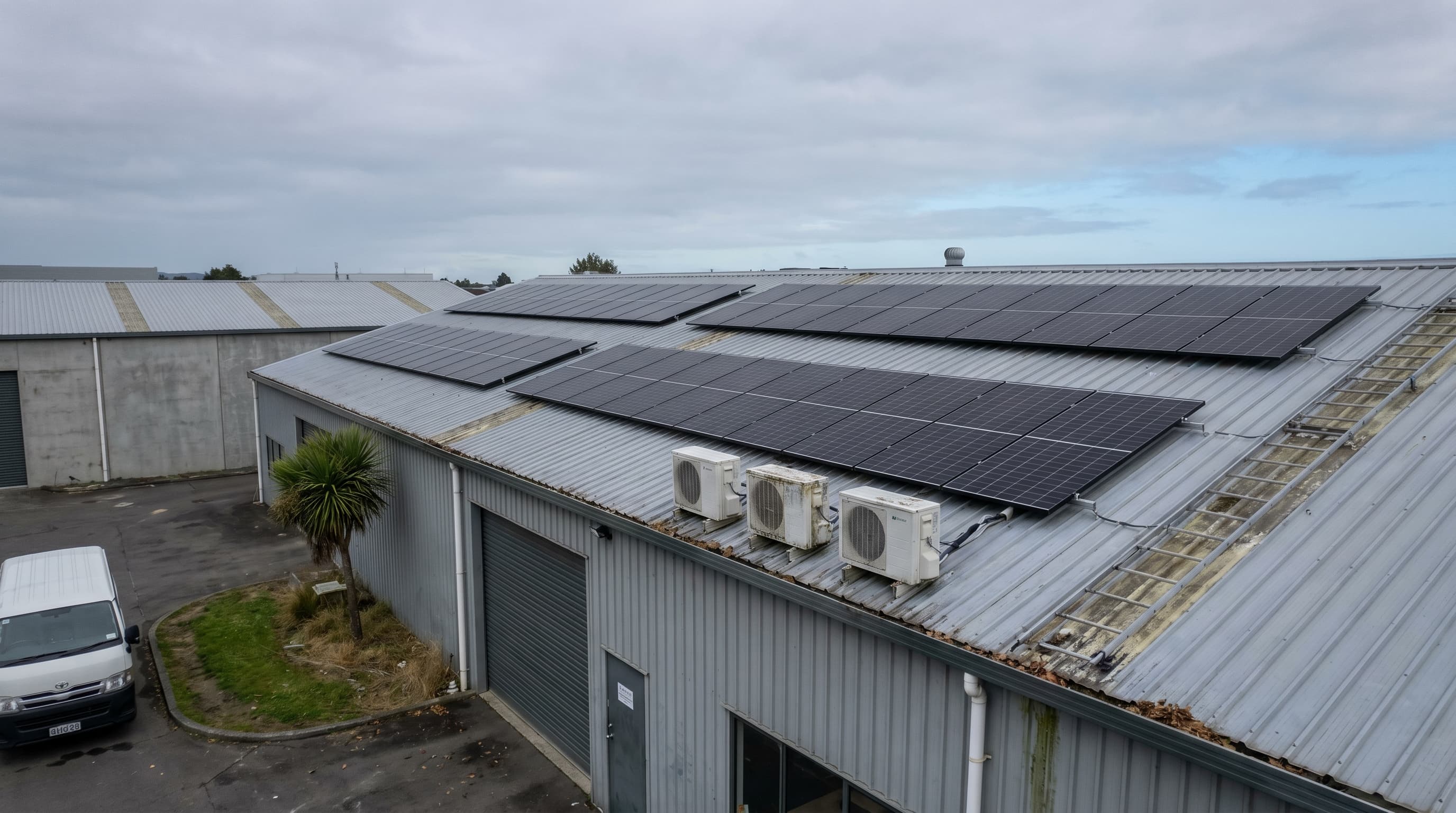 Drone view of solar panels installed on a commercial warehouse rooftop in New Zealand