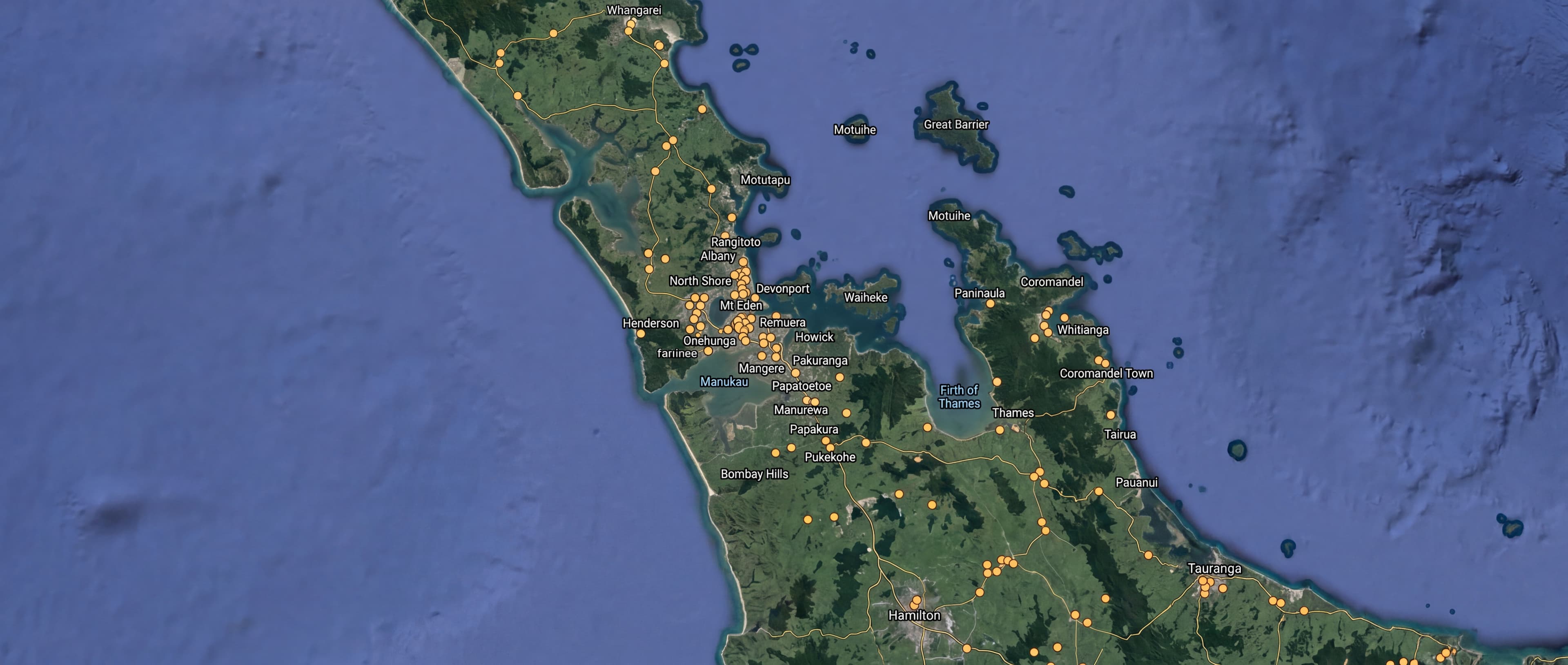 Satellite view of New Zealand with amber markers on major regions